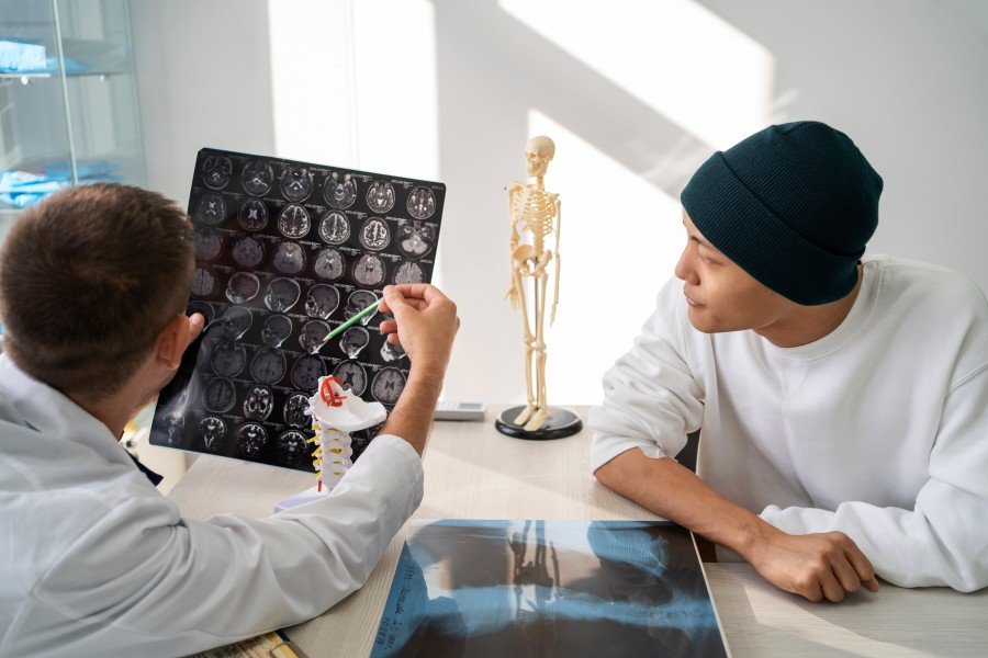 Doctor discussing brain scan results with a patient during a neurological consultation