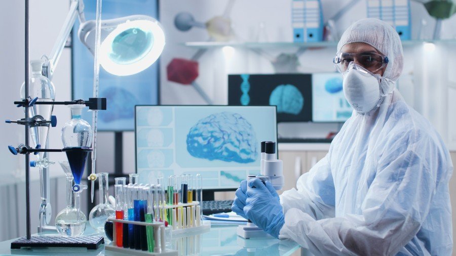 Neurotherapy specialist analyzing brain-related medical data in a laboratory