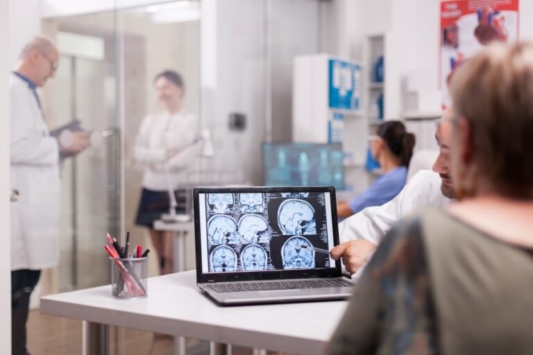 Neurotherapist discussing brain scan results with a patient