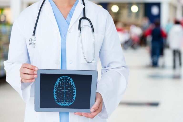 Doctor holding a tablet displaying a brain illustration, representing Neurotherapy and neurological healthcare.